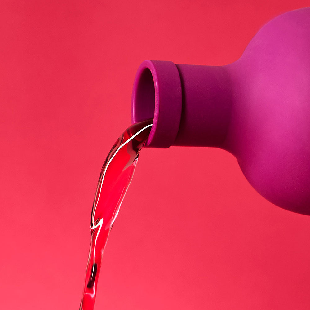 plum purple cold brew tea bottle pouring tea