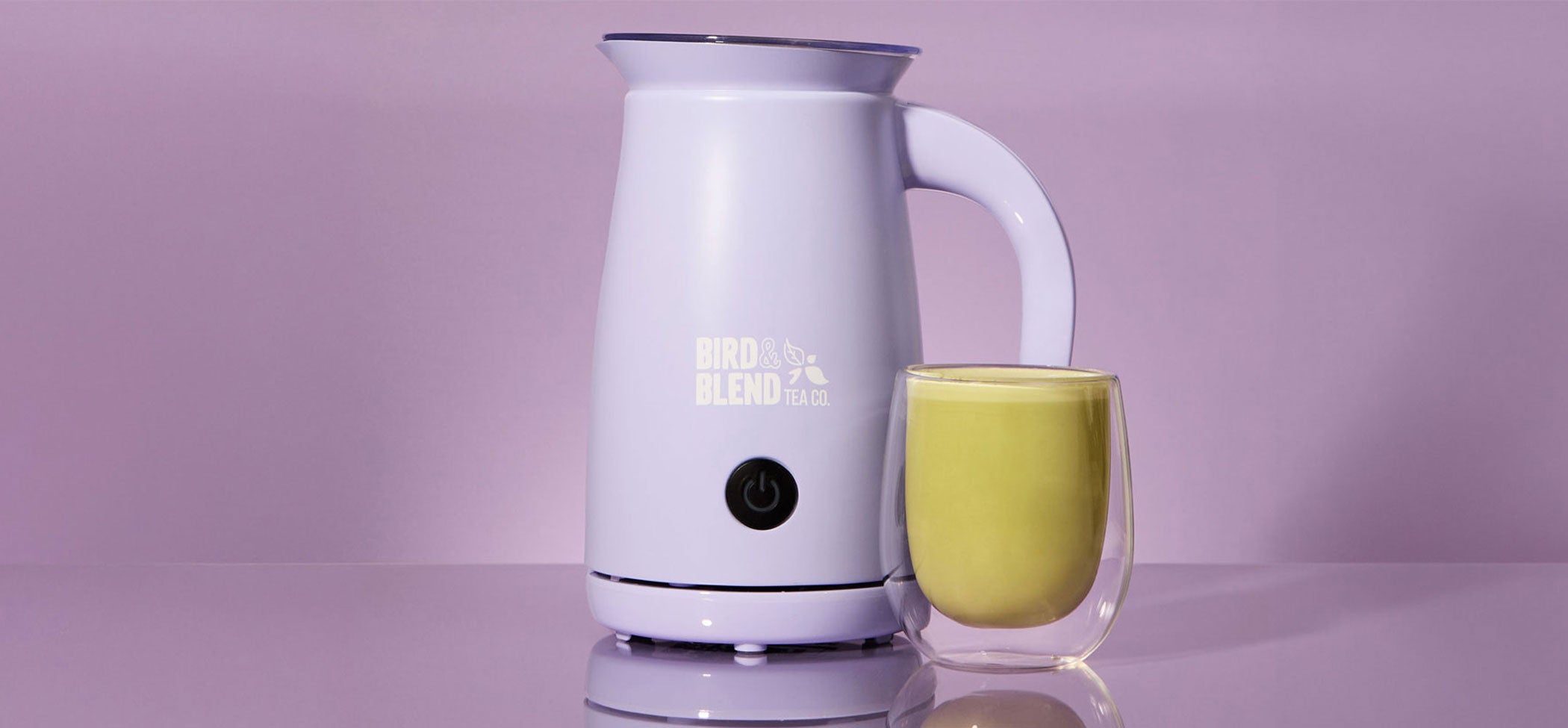new soft lilac matcha latte magic whisk and hot matcha latte tea purple background