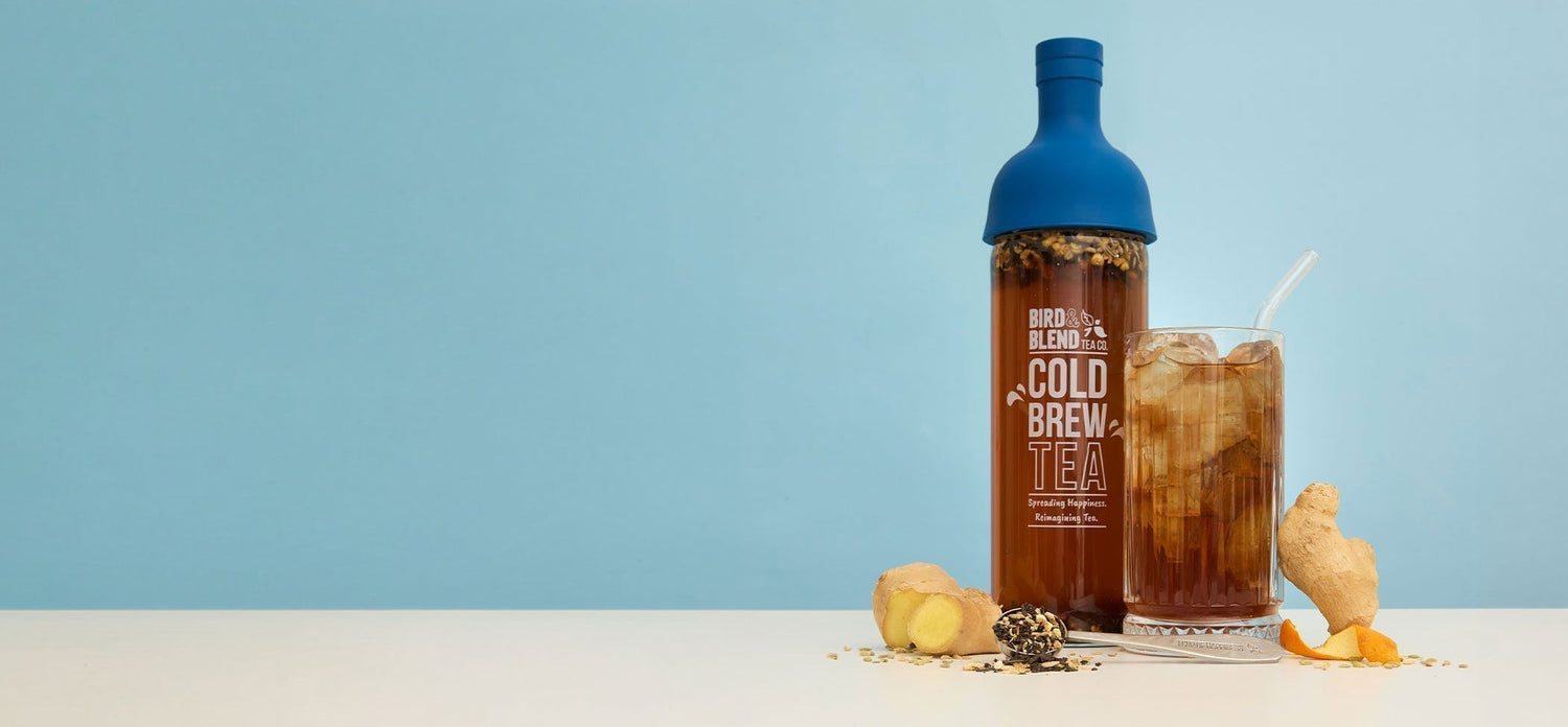 The digester iced cold brew tea & cold brew tea bottle sapphire blue & ginger & spoon filled with loose leaf tea