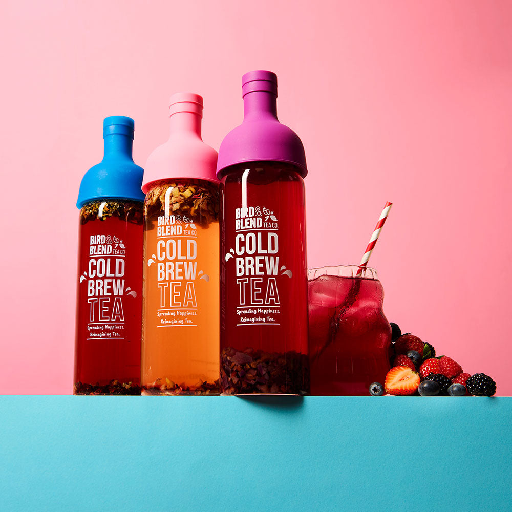 peachy pink plum purple &amp; sapphire blue cold brew tea bottle filled with tea &amp; iced tea