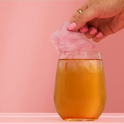 Baby Spice Iced Tea Mocktail With Candy Floss Topper &amp; Hand Picking Up Candy Floss