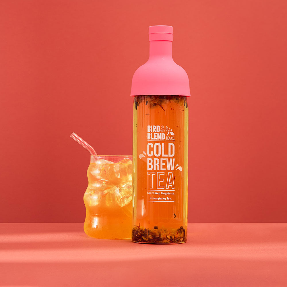 baby spice peachy pink cold brew tea bottle filled with tea &amp; iced tea