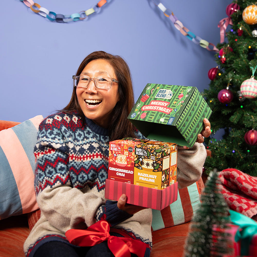  christmas tea bag selection box person holding open box filled with 4 different 15p tea bag gift boxes 