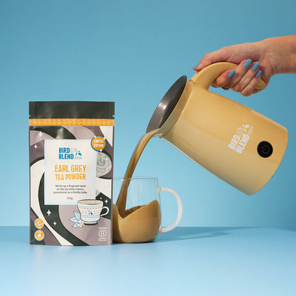 earl grey tea powder pouch and bamboo gloss magic latte whisk pouring hot latte