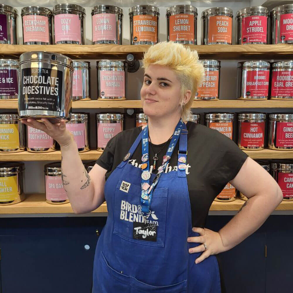 edinburgh store manager holding chocolate digestives tea