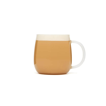 glass tea infuser mug with tea latte in