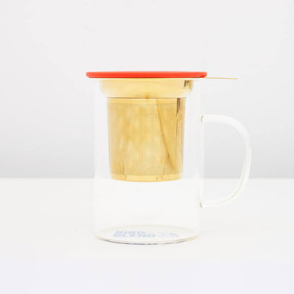 loose leaf infuser in gold in a mug