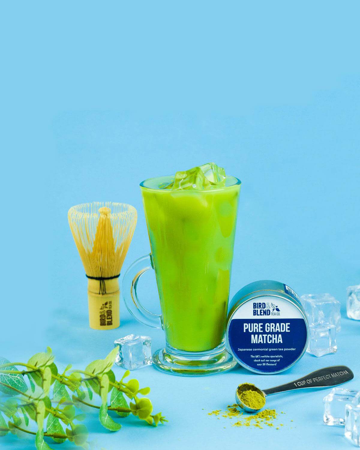iced pure matcha latte with bamboo whisk