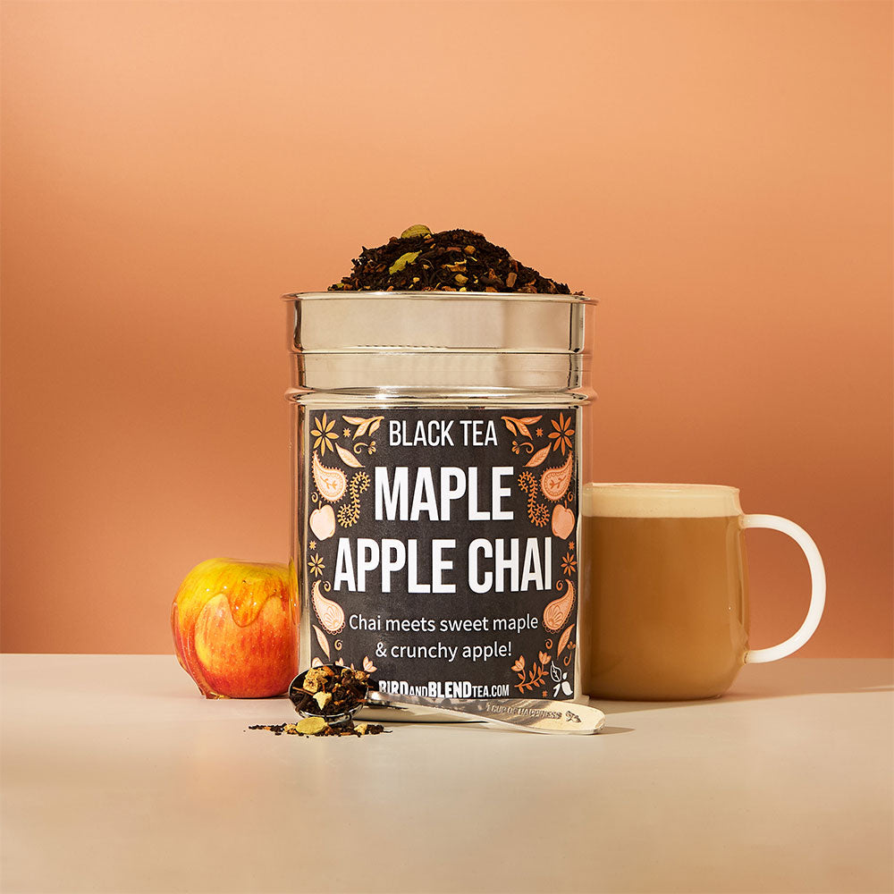 hot maple apple chai latte &amp; apple covered in maple syrup &amp; perfect tea spoon filled with loose leaf tea &amp; maple apple chai custom tea tin