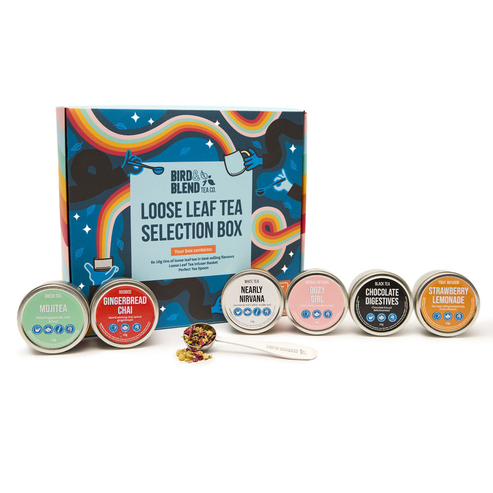 loose leaf selection box closed and loose leaf tea tins and spoon filled with loose leaf tea