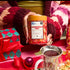 person holding gingerbread chai tea gift tin