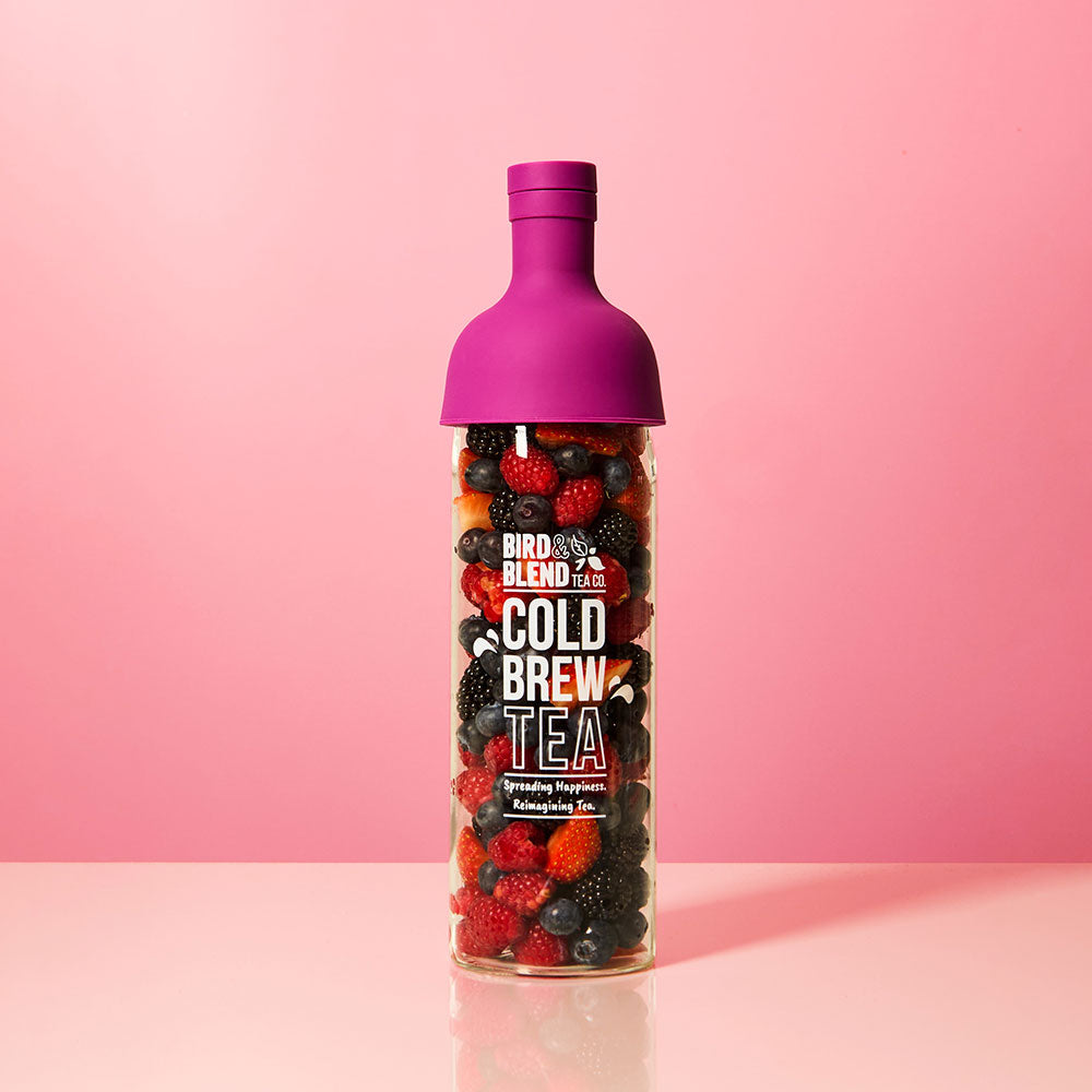 plum purple cold brew tea bottle filled with summer fruits