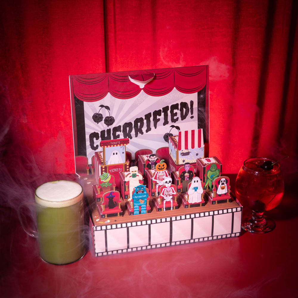 spooky countdown calendar open showcasing all characters &amp; hot matcha latte and iced cherry tea