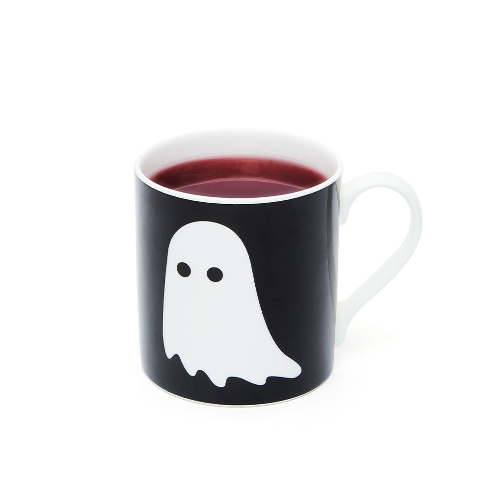 spooky Halloween ghost mug filled with tea