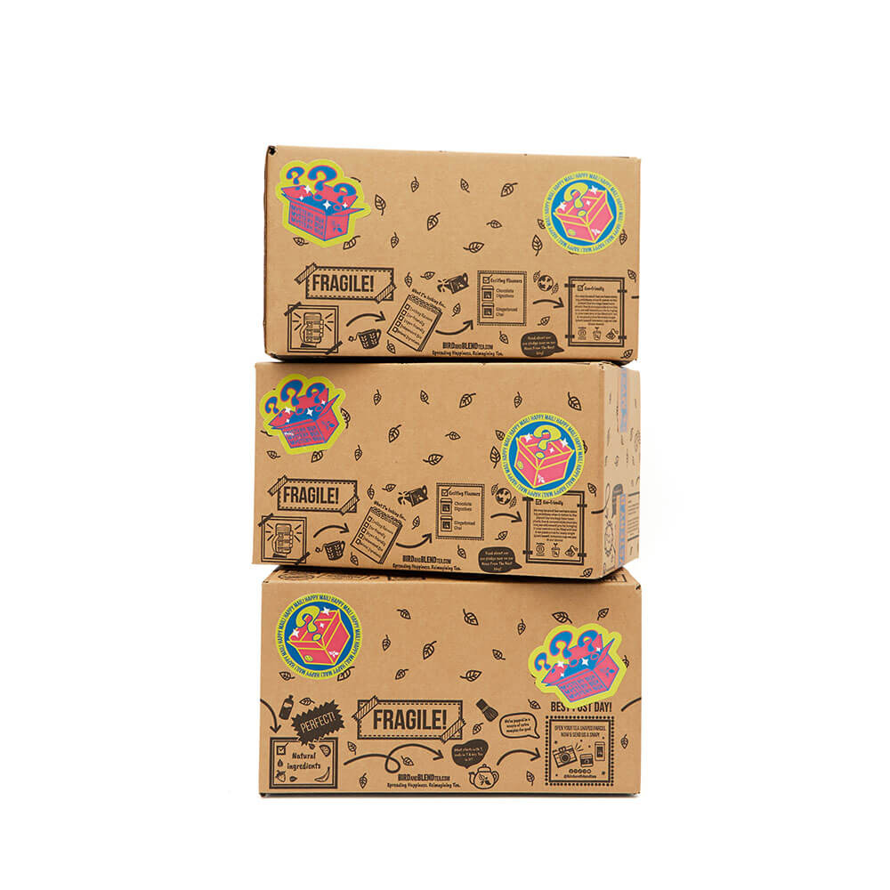 Three mystery tea boxes stacked including Classic, bumper and mega mystery tea boxes.
